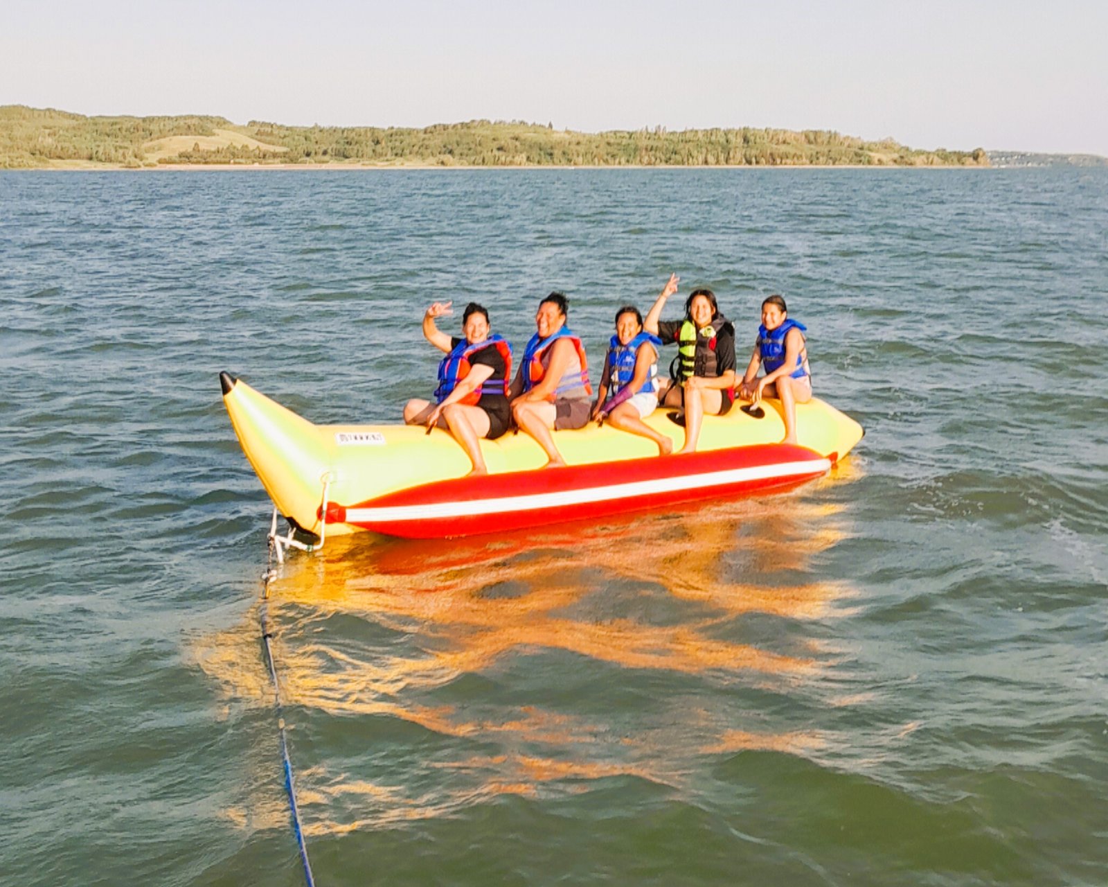 Towable tube ride behind a boat